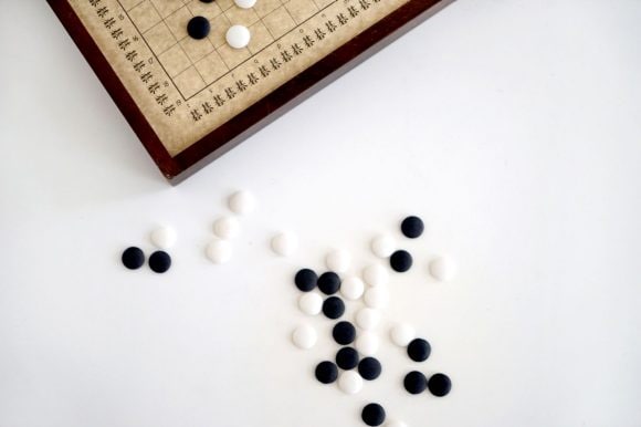 Board game with black and white pieces.