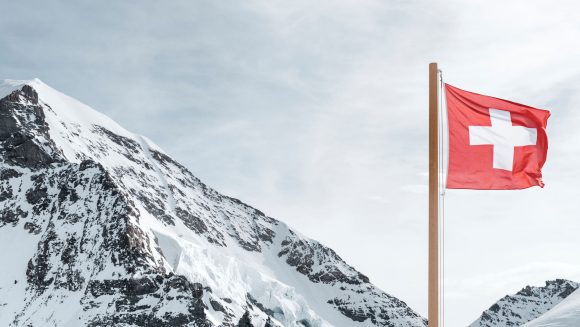 Swiss flag in mountains
