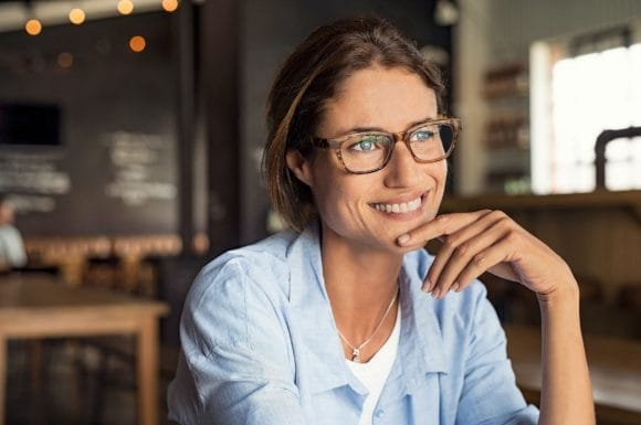Smiling women sitting at table