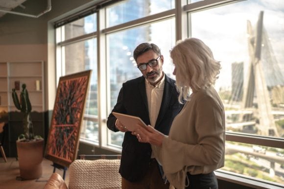 Business partners using digital tablet