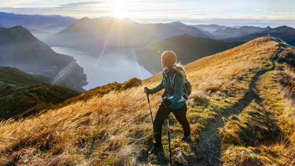 Woman hiking along mountain ridge