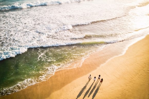 Family walking on the beach