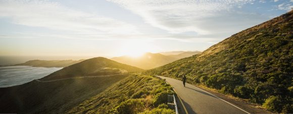 Person on winding mountain road