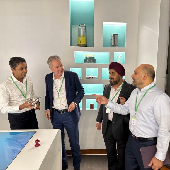 Four UBS employees discussing at a research and development centre