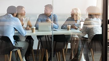 Viewing a team meeting through the glass conference room