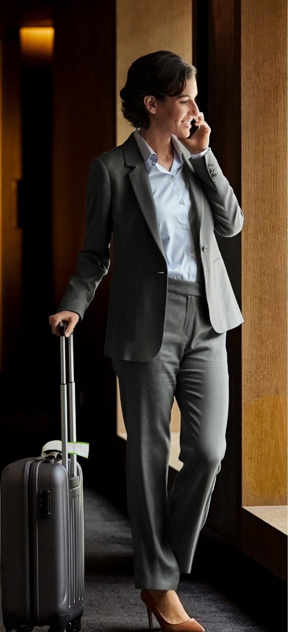 Woman in business attire speaking on the phone