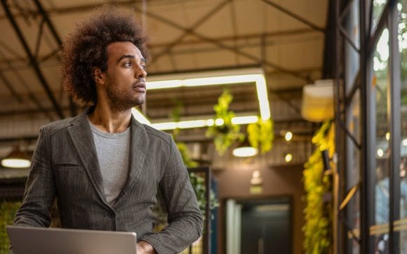 Man on computer looking away