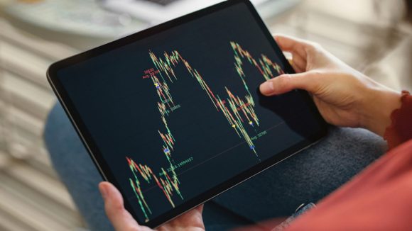 Electronic display of a stock chart showing up and down direction