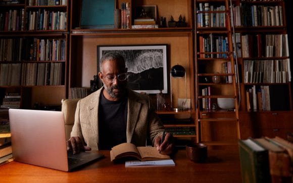 Close-up of man in home office and library