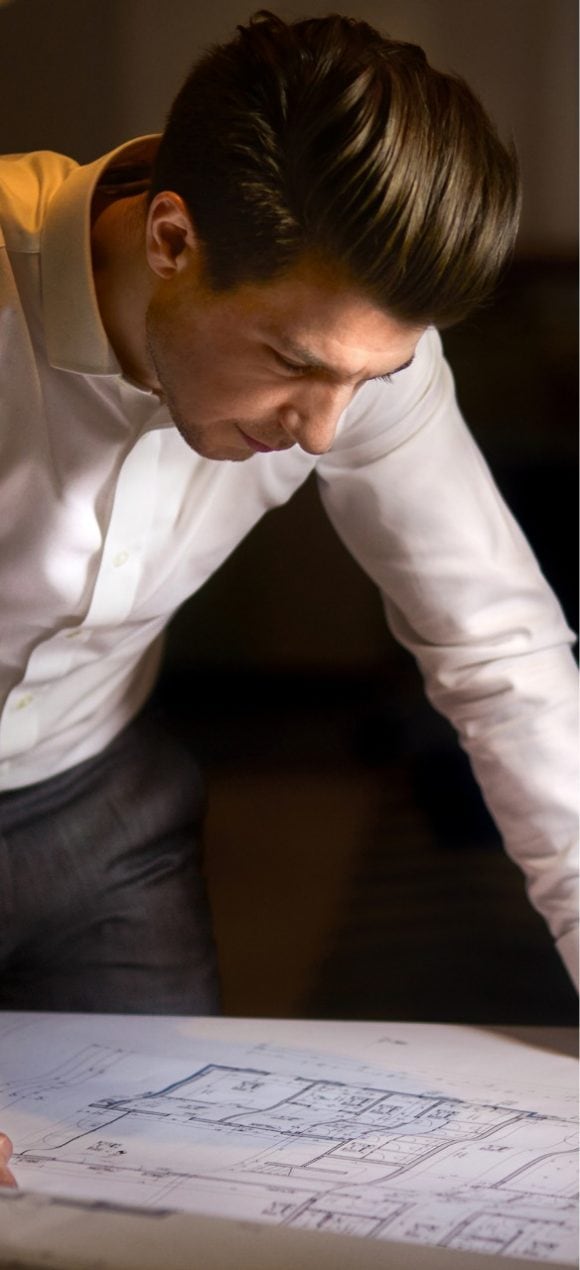 Man working on a archtecture drawing