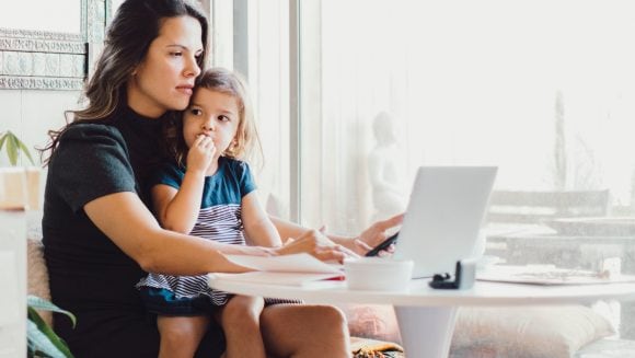 Mother and daughter using laptop computer