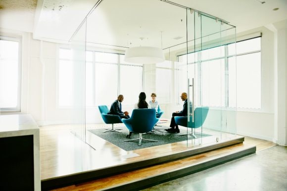 Team of businesspeople discussing project in office conference room