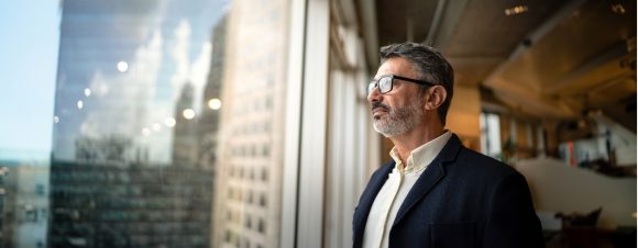 Businessman looking out window