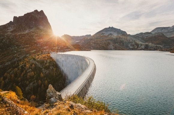 Sunset over reservoir dam