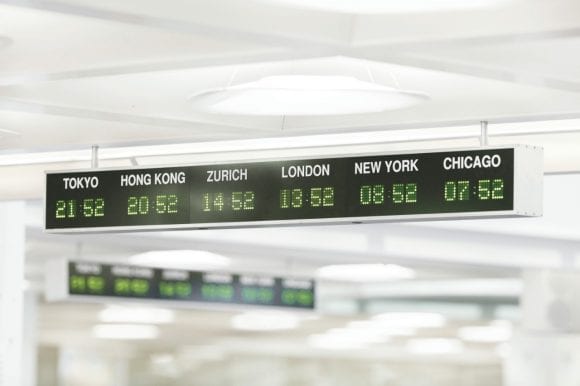 Digital time zone signs for Tokyo, Hong Kong, Zurich, London,, New York and Chicago.