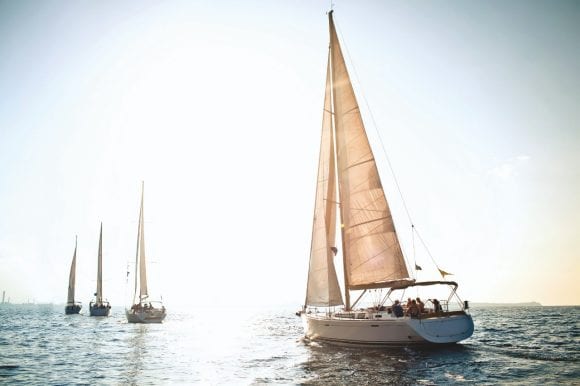 Sailboats sailing on water