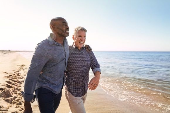 Senior gay couple on the beach
