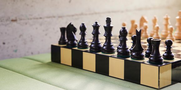 Chess board on table.