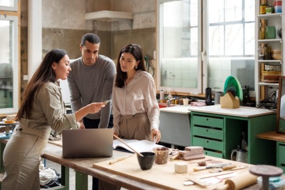 Artist talking to clients in studio