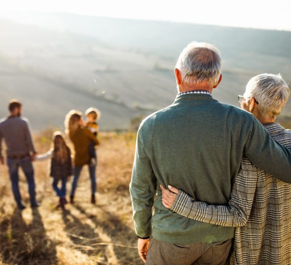 Senior couple with family in nature