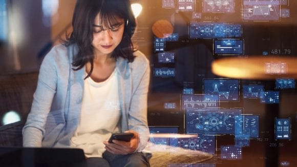 Woman in front hologram screens