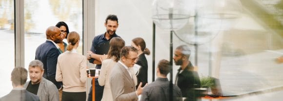 Male and female colleagues talking in office