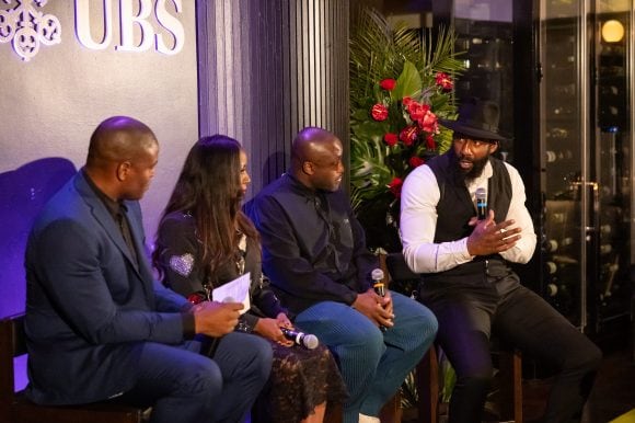 Amar’e Stoudemire, Bisa Butler, Larry Ossei-Mensah and Wale Ogunleye on stage speaking