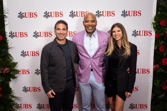 UBS employees smiling at the camera
