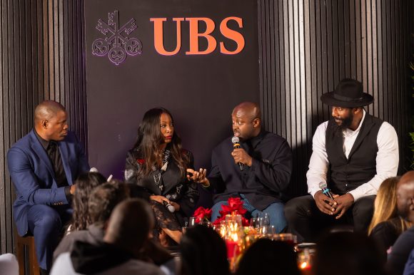 Larry Ossei-Mensah speaking on stage