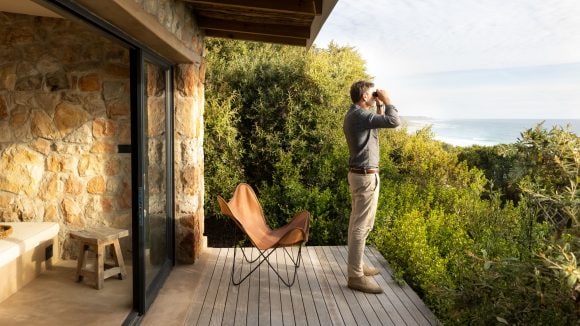 Man looking through binoculars