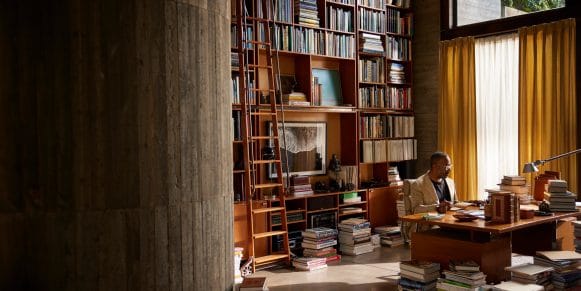 man sitting in a library